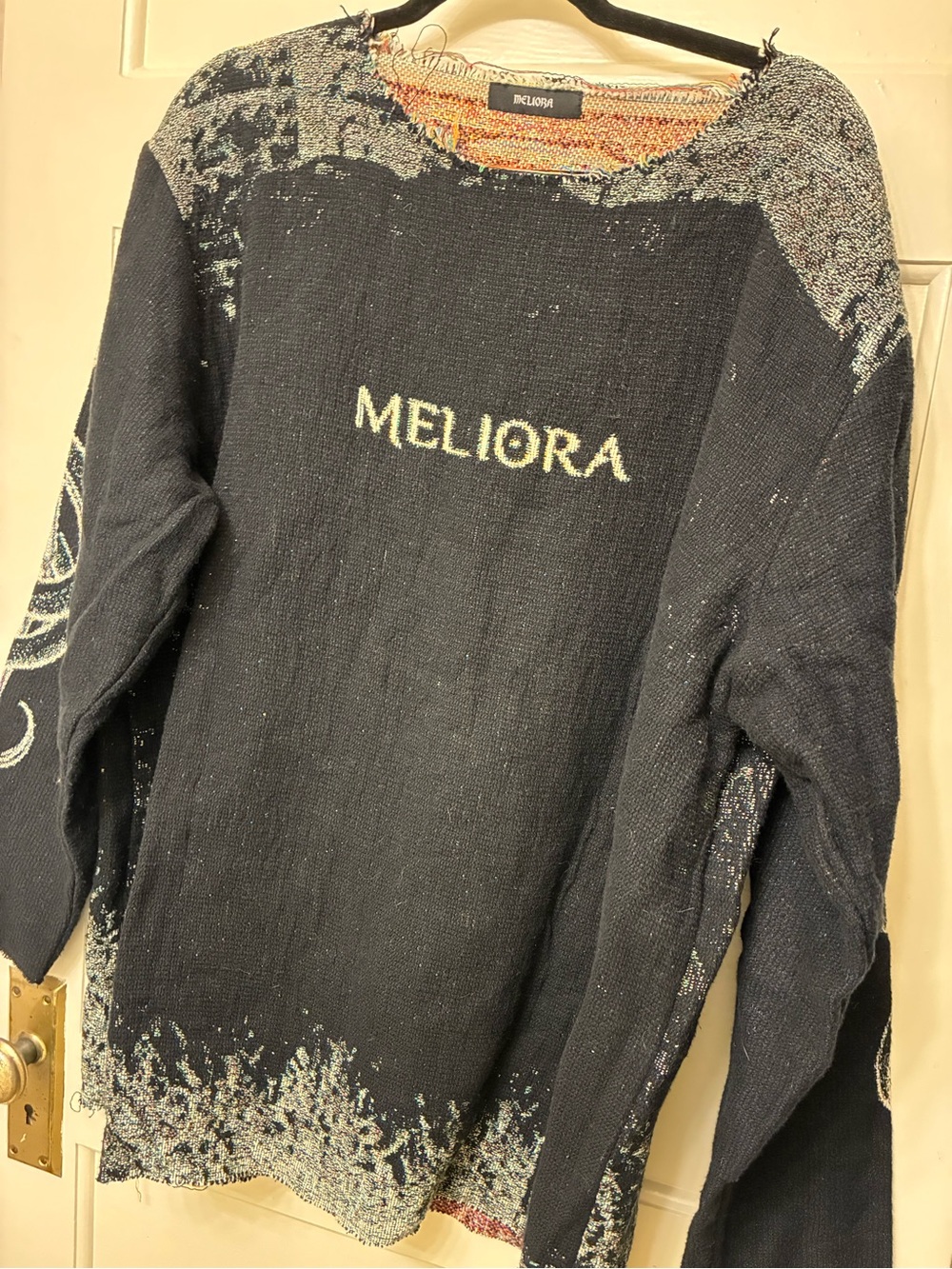 Meliora frayed edge sweater